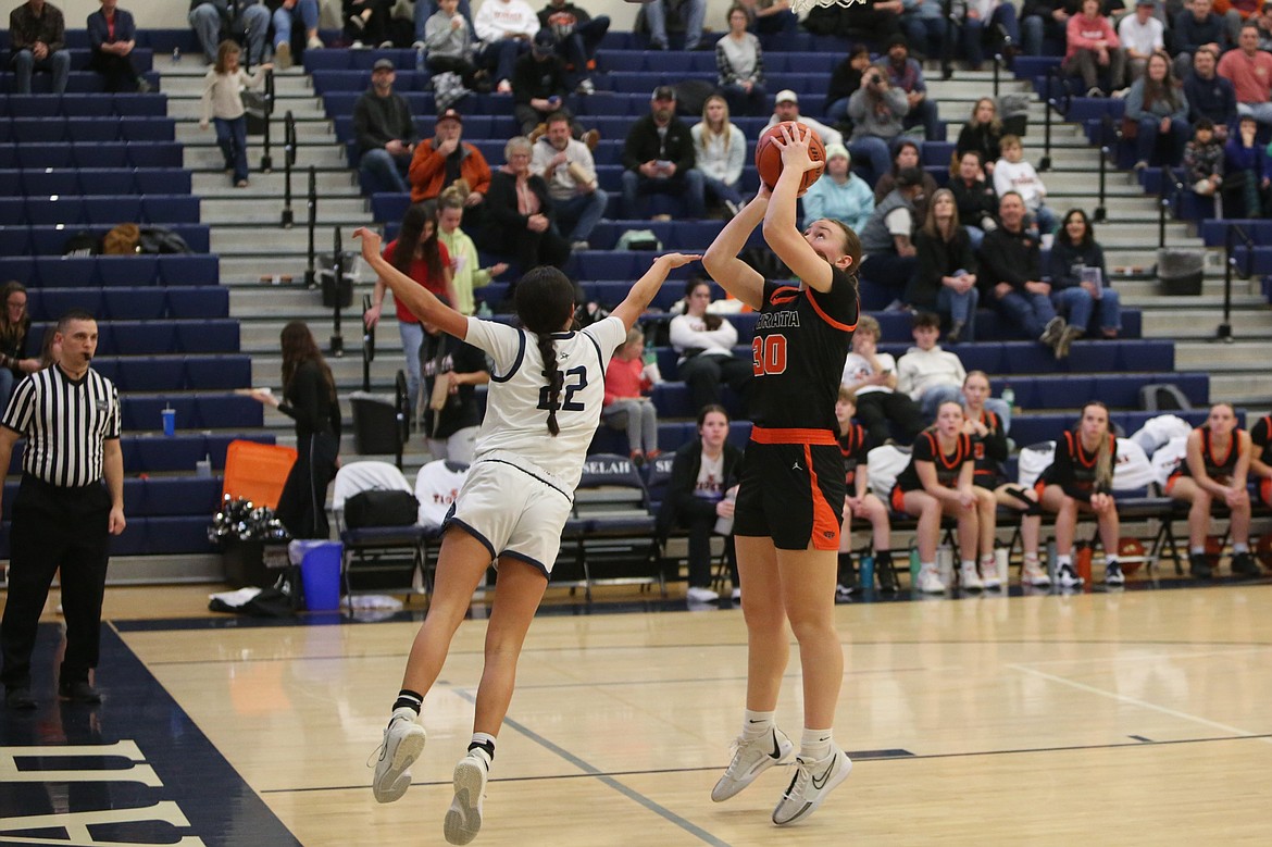 Ephrata senior Addison Mills (30) attempts a shot in the second half against Selah Friday night.