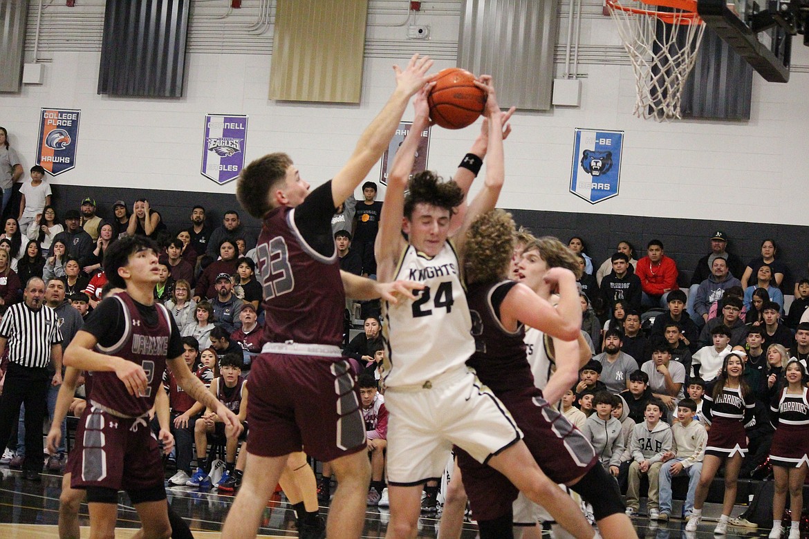 Royal Coach Greg Jenks said rebounding was a key factor in the Knights’ win over Wahluke. Grant Wardenaar (24) hauls down the rebound, contested by Wahluke’s Keaton Zirker (23).