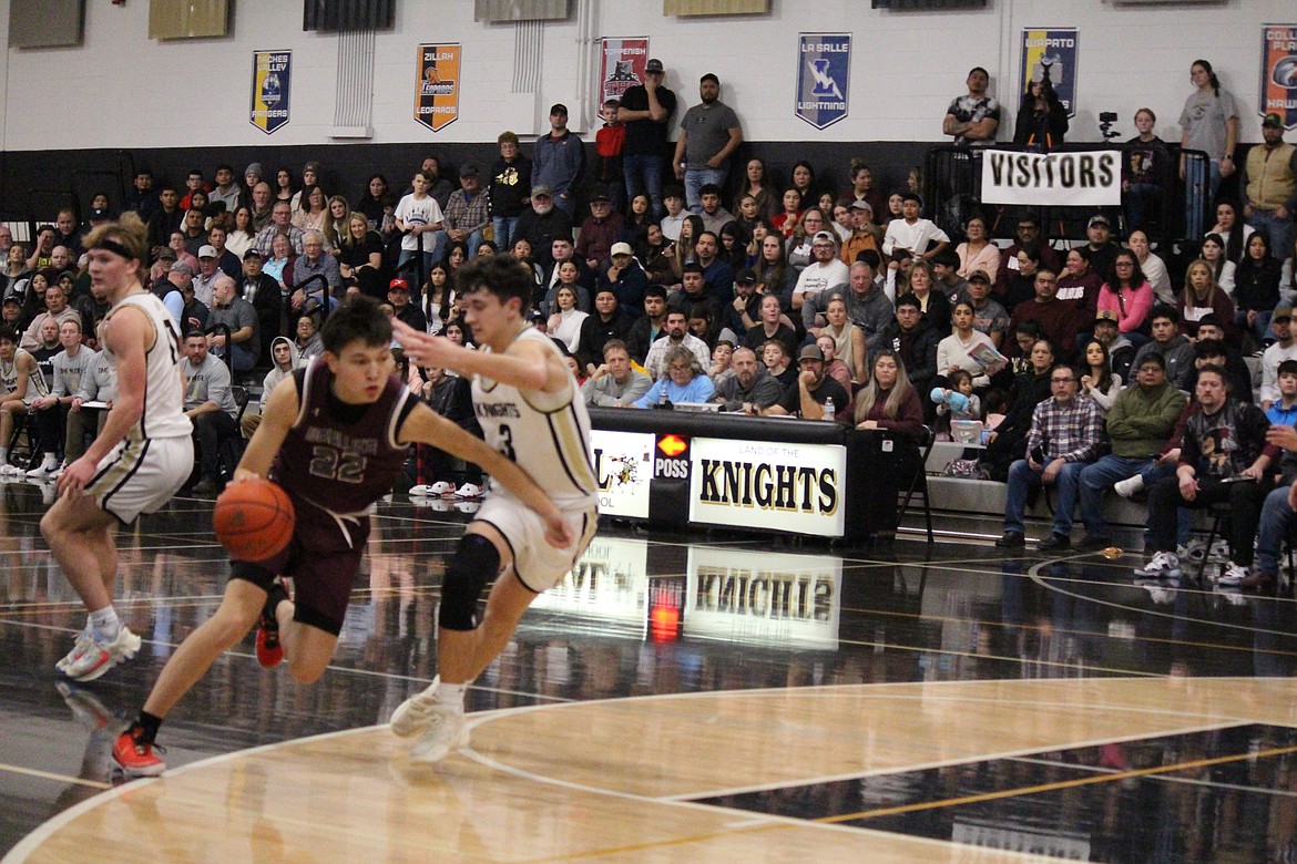 Wahluke’s River Buck (22) drives the lane in the Warriors’ hard-fought game at Royal Friday.