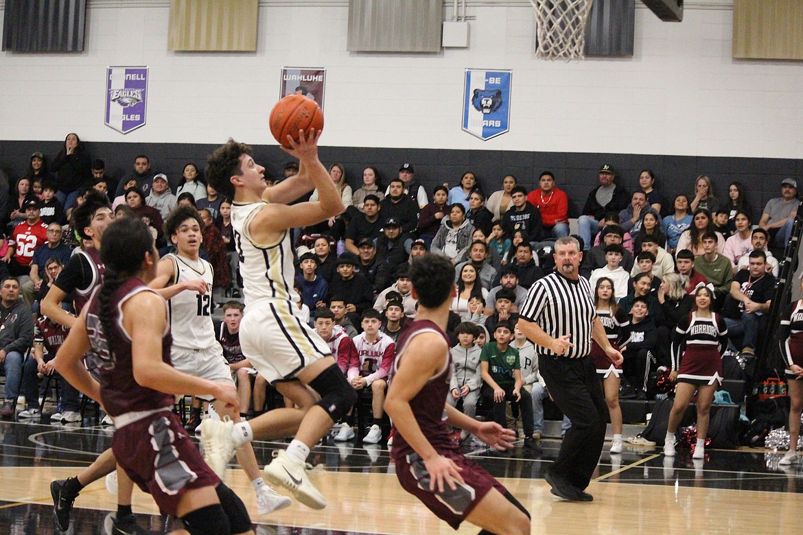 Diego Perez of Wahluke (4) gets around the baseline defense.