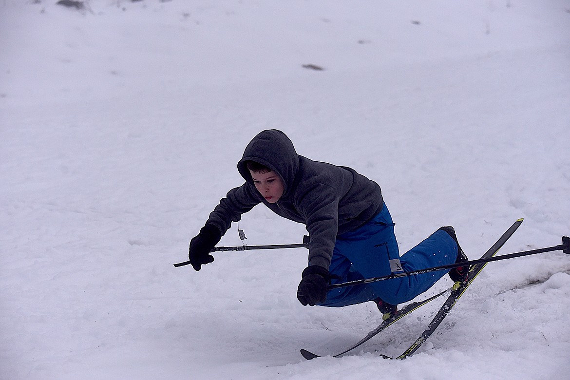 Levi Harmon is about to face plant after skiing over a ramp on Tuesday, Jan. 30, during the Kootenai Outdoor Adventure Program's festival ski day at the South Flower Creek Ski Area. (Scott Shindledecker/The Western News)