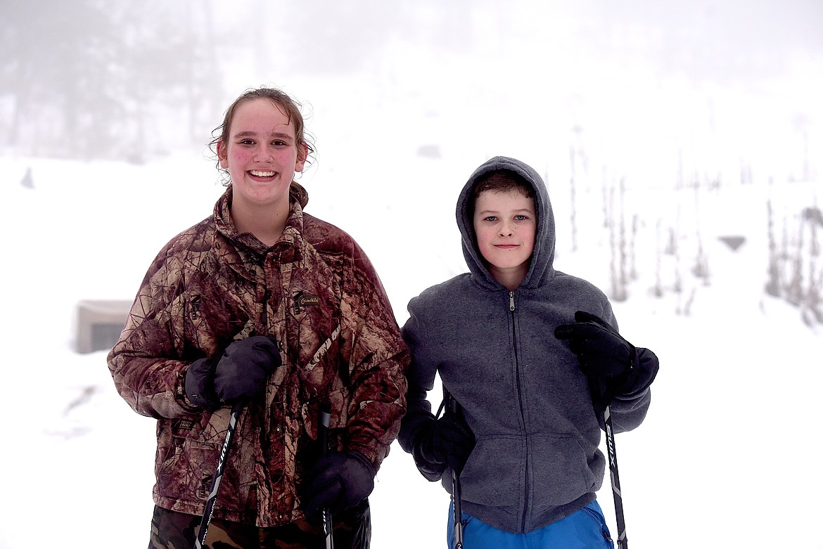 Good friends Abigail Kirk and Levi Harmon enjoyed themselves on Tuesday, Jan. 30, during the Kootenai Outdoor Adventure Program's festival ski day at the South Flower Creek Ski Area. (Scott Shindledecker/The Western News)