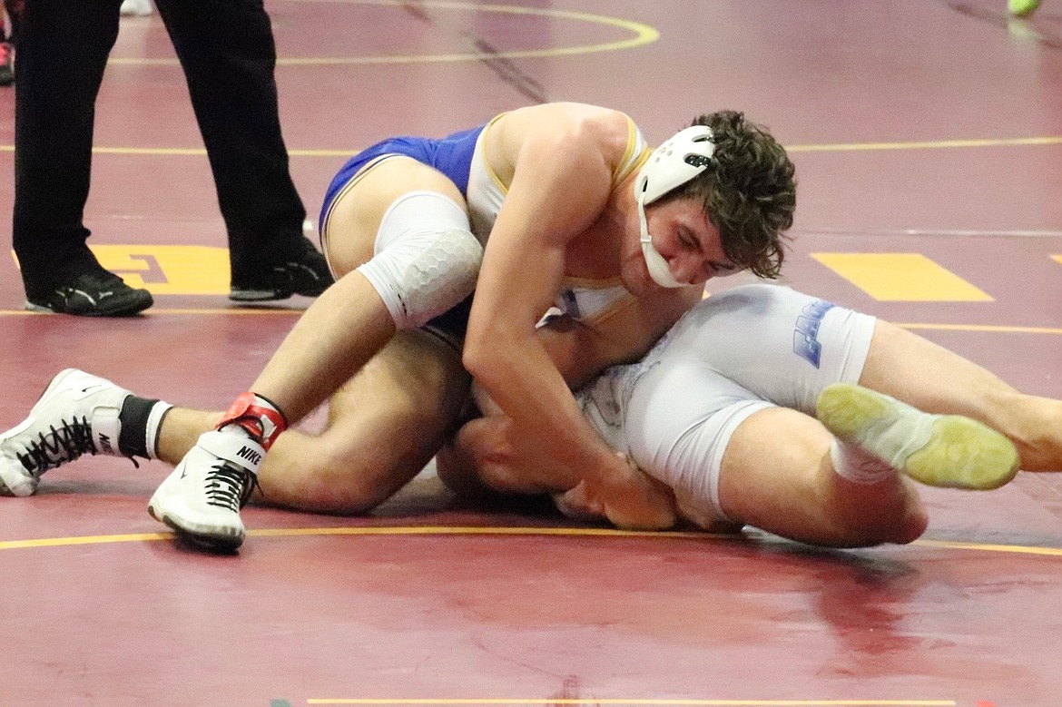 Thompson Falls senior Max Hannum (top) during his championship run at 182 pounds in this past weekend's Western Division wrestling championships in Shelby.  (Photo by Kami Milender)