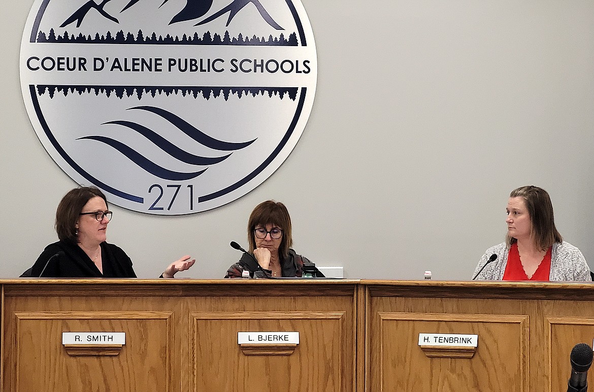 Chair Rebecca Smith, left, speaks to her fellow Coeur d'Alene School Board trustees at the beginning of Monday's special meeting. Also pictured, from left: Vice Chair Lesli Bjerke and Trustee Heather Tenbrink.