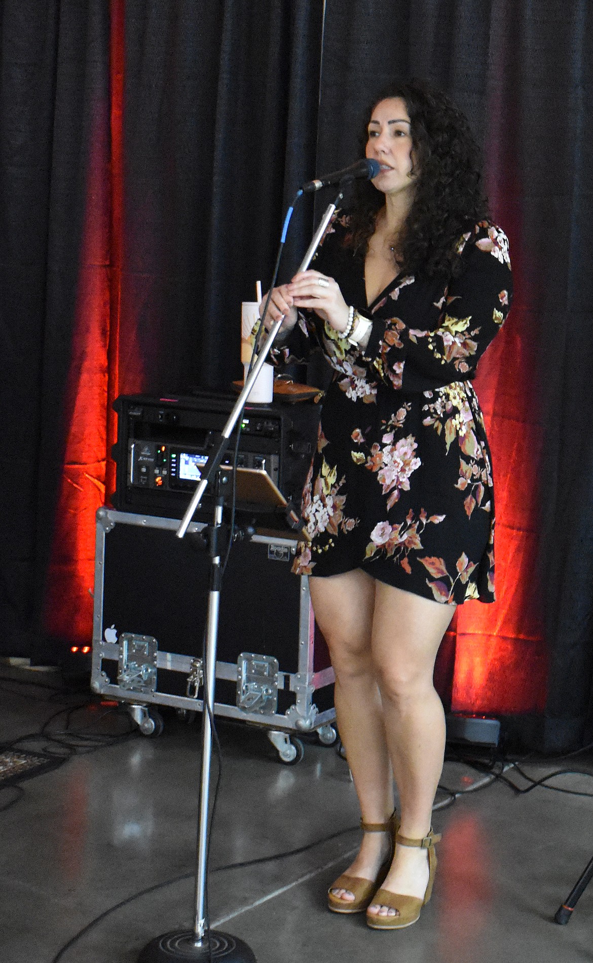 Jamie Nasario, of the musical duo Jamie and Luke, sings before the Country Sweethearts Benefit Auction Saturday.