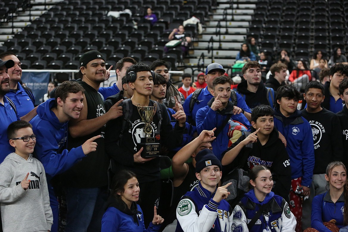 Warden wrestlers celebrate after winning the Eastern Washington Athletic Conference (East) district tournament.