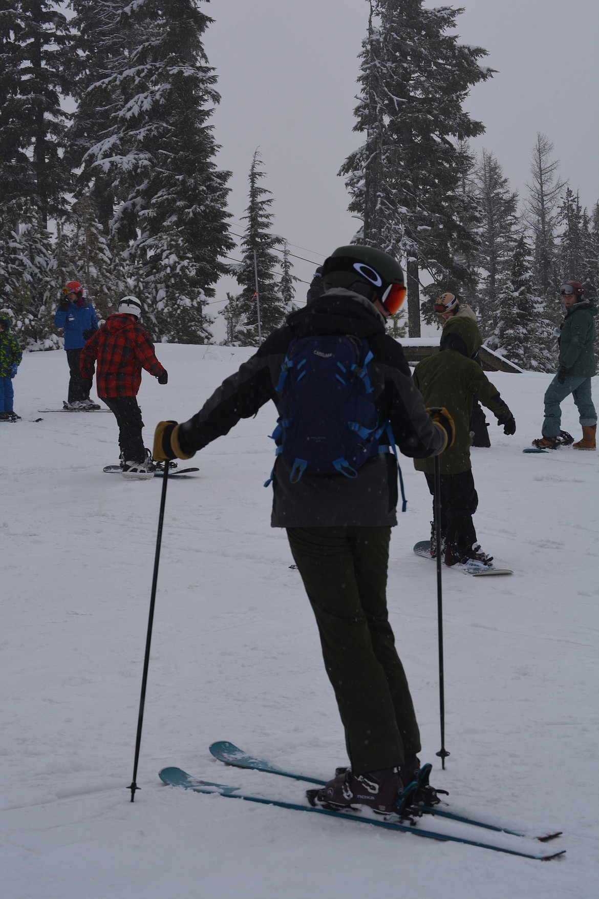 Nick Boonstra looks over his shoulder for Kyle Domfort as they go to make their first trek down the ski slopes at Silver Mountain Resort. The two are pilots for Fairchild Air Force Base.