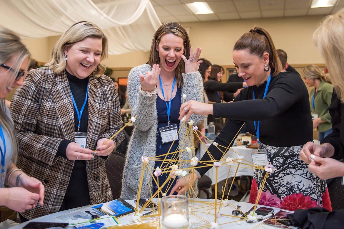 Attendees participate in a hands-on team-building activity during the 2023 Mamas in Business Annual Conference. This year's conference is March 15.