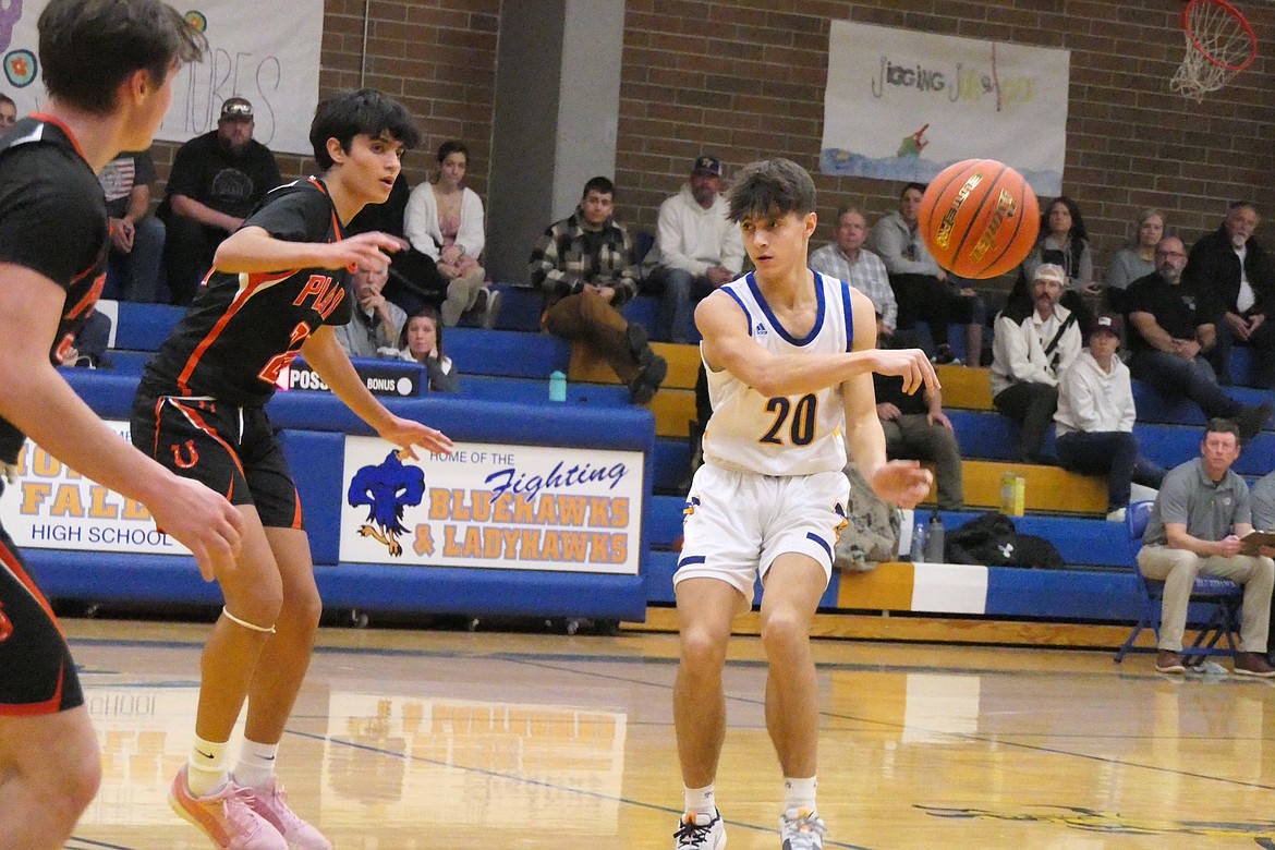 Thompson Falls junior Sam Burgess (20) snaps a no-look pass by Plains defender Pablo Hernandez during their game Thursday night in Thompson Falls. (Chuck Bandel/VP-MI)