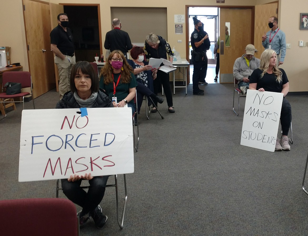 In this April 19, 2021 CDA Press file photo, the majority of those who attended a special meeting of the Coeur d’Alene School District Board of Trustees did not wear masks and many brought anti-mask signs. During that meeting, the board rescinded the district’s mask requirement and made masks “strongly recommended.”