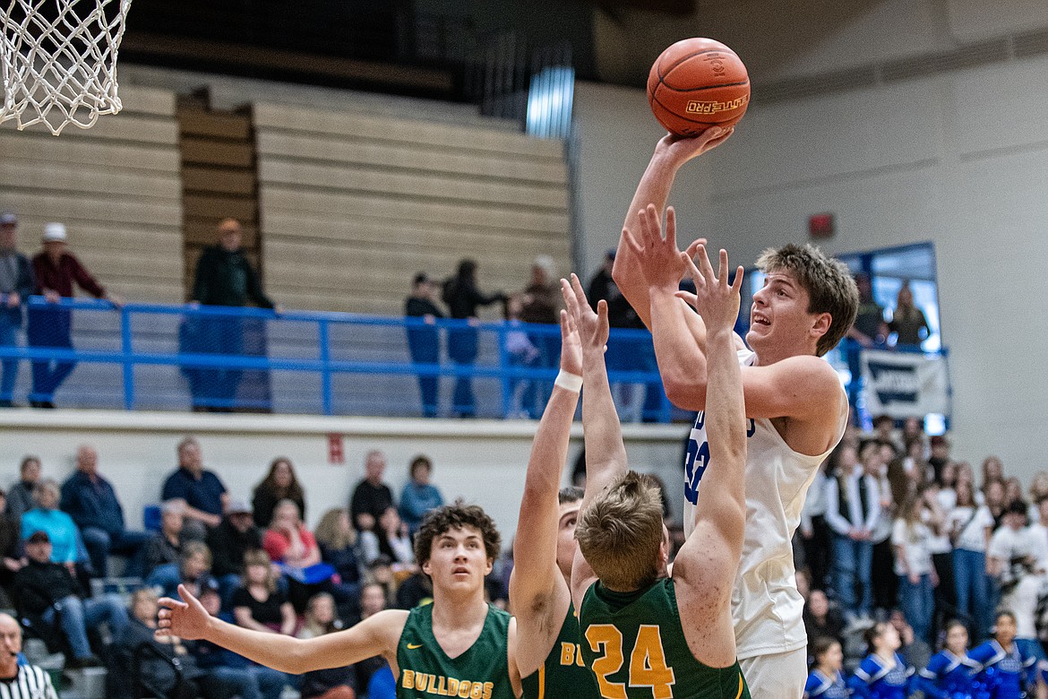 Wildcat Cody Schweikert makes two against Whitefish at home Tuesday, Jan. 30. (Avery Howe photo)