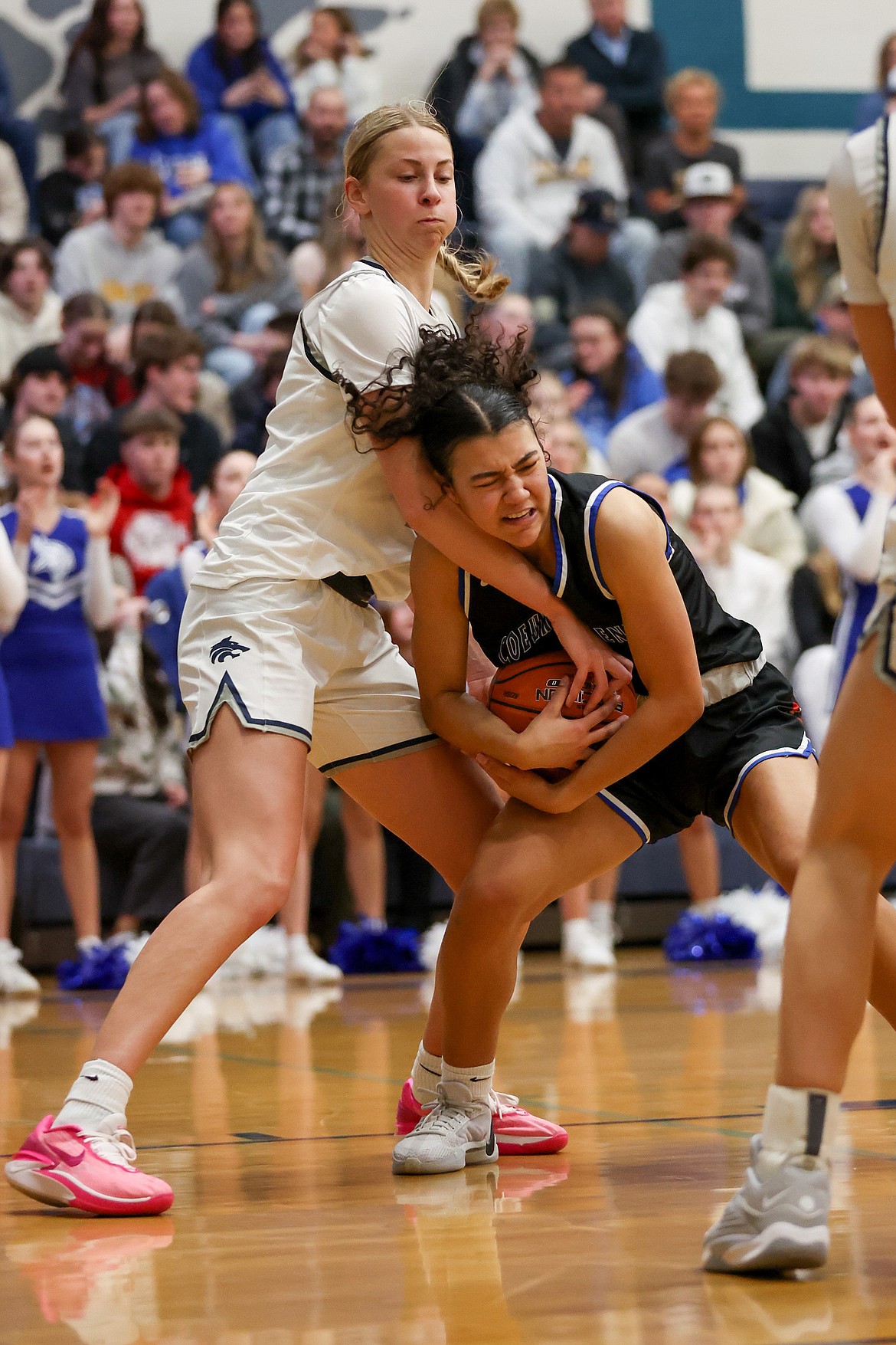 JASON DUCHOW PHOTOGRAPHY
Lake City senior Avery Waddington attempts to pry the ball from Coeur d'Alene freshman Brookeslee Colvin during the second half of Tuesday's 5A Region 1 girls basketball championship game at Lake City High.