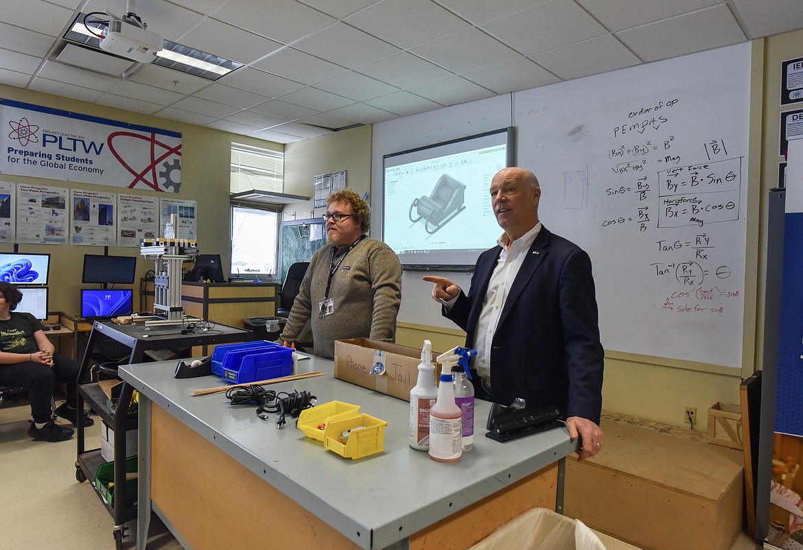 Gov. Greg Gianforte talks to students participating in an engineering career and technical education program alongside program teacher Troy Smith on Feb. 6, 2024 at Glacier High School. (Kate Heston/Daily Inter Lake)