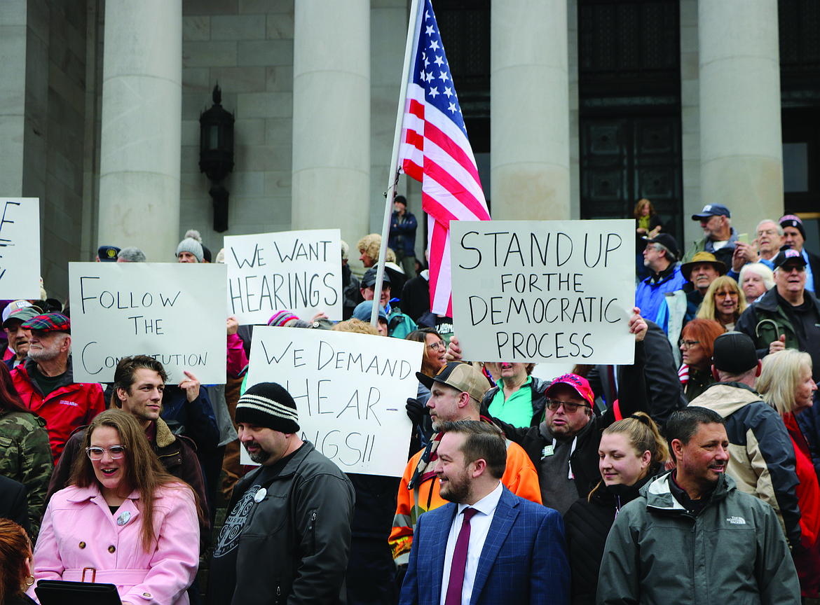 Washingtonians from all over the state gathered on the north steps at the state Capitol in Olympia, for a rally planned only a week in advance. Protesters displayed signs that read “We want hearings,” and “Follow the constitution.”