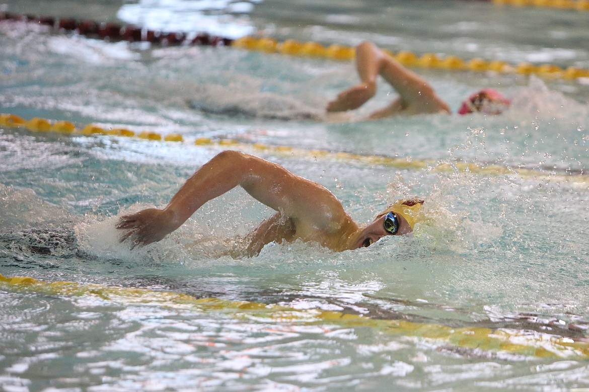 Moses Lake sophomore Sam Molitor, foreground, competes in the preliminary round of the 200-yard freestyle. Maverick senior Damien Paluch, background, won a district title in the 200-yard freestyle.