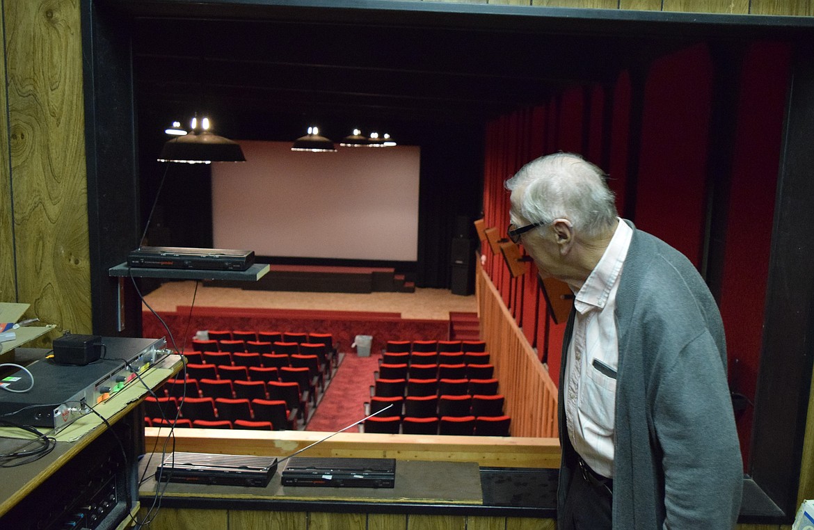 Bob Reichert looks down from the viewing room above Reichert’s Showhouse 3’s original auditorium, which the Reicherts had to completely restore after it was left in disrepair by the previous owners of the theater.