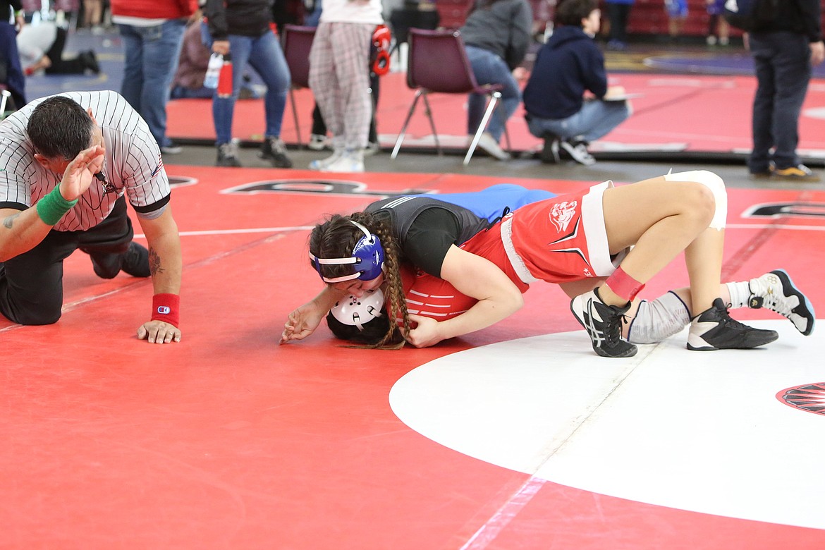 Warden senior Jada Hernandez, top right, works for a pin in Friday’s 2A/1A/B District 5 Sub-Regional at the Yakima Valley SunDome.