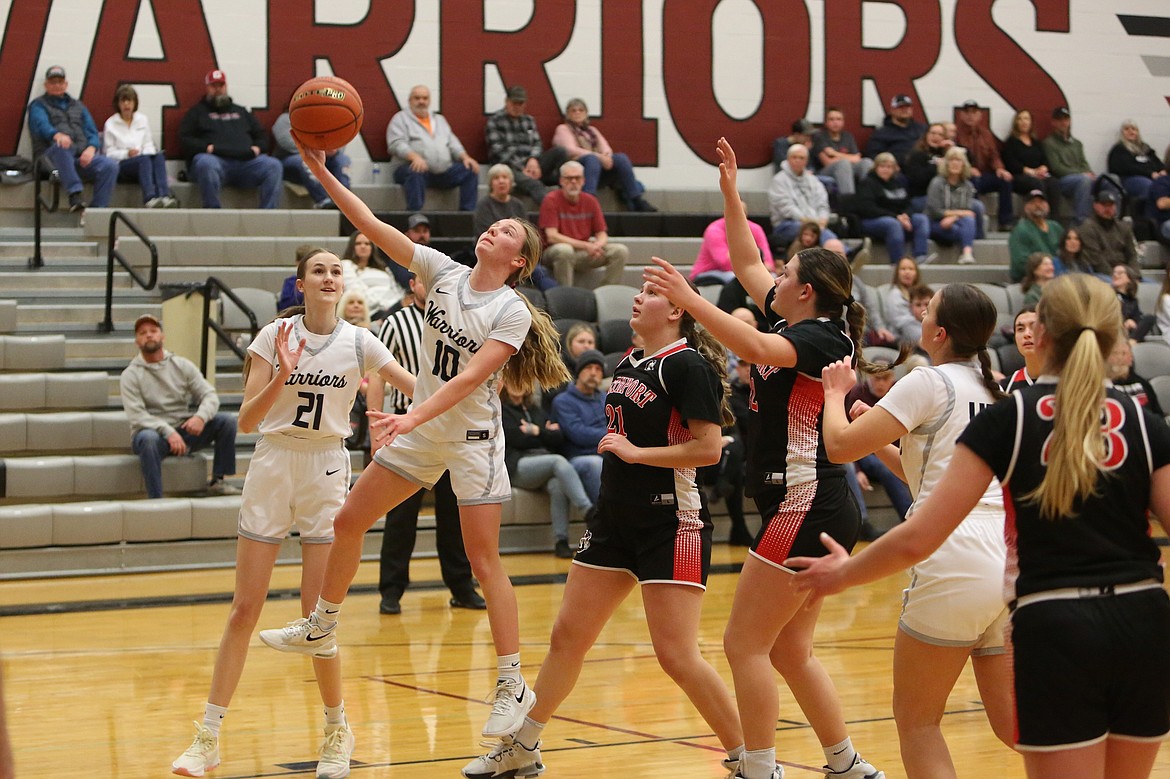 ACH sophomore Naomi Molitor (10) drives toward the rim for a layup in the first quarter of Tuesday’s 54-24 win over Northport. Molitor led the Warriors with 13 points.