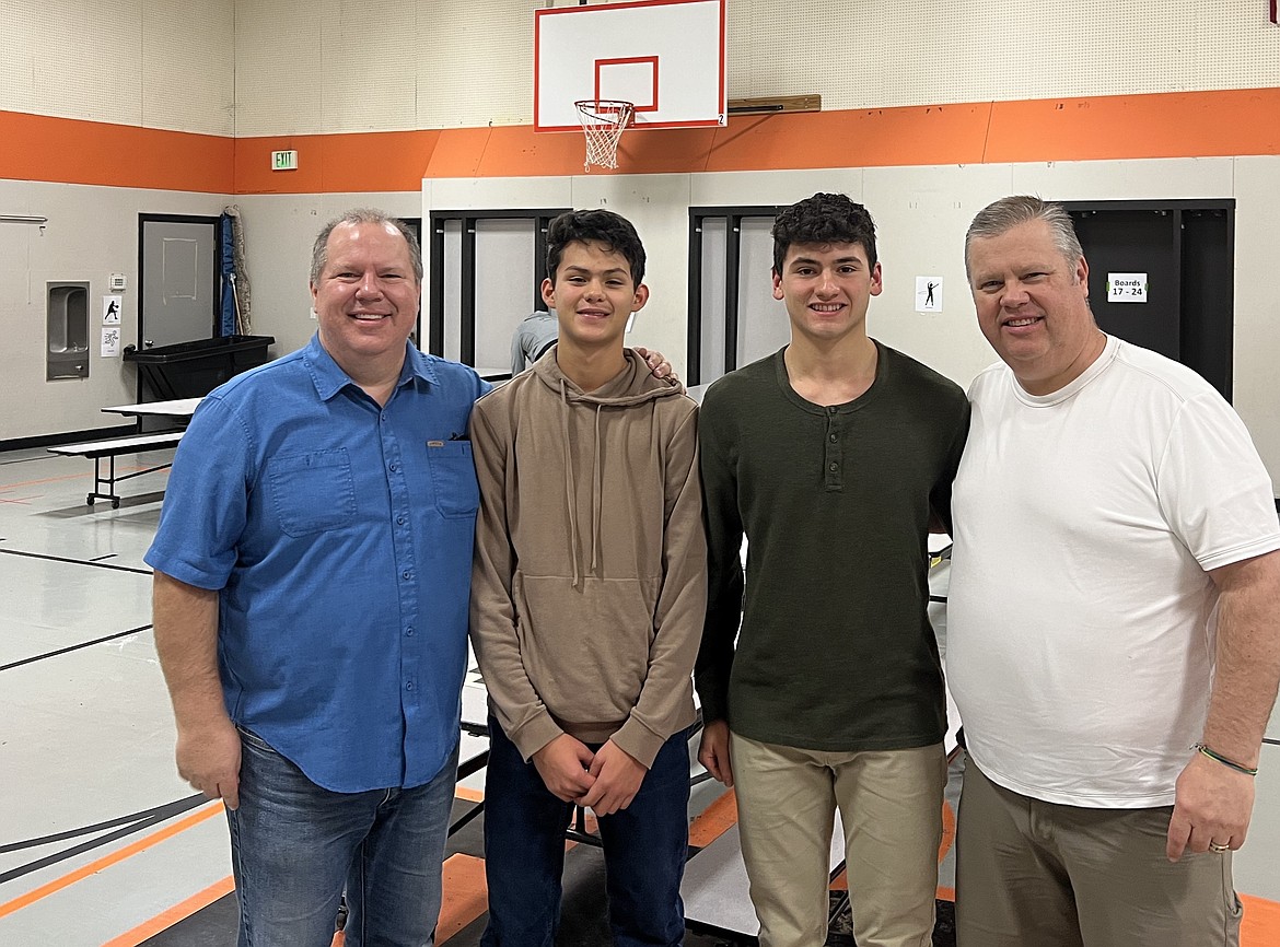 Waypoint Foundation Trustee Troy Pugh, left, stands next to Julian Ochoa Medina, in brown, who took second place at this year’s Waypoint Foundation Scholastic Chess Tournament. In green is this year’s champion, Hayden Malone, a senior at Ephrata High School, and on the right is Waypoint Foundation Trustee Roger Pugh.