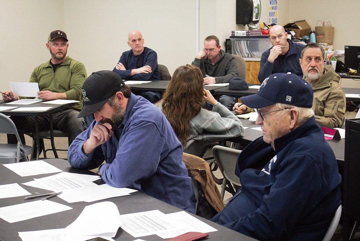 Boundary County School District facility committee members discuss future maintenance plans for the school district (left front) Ryan Comer and Ron Smith.