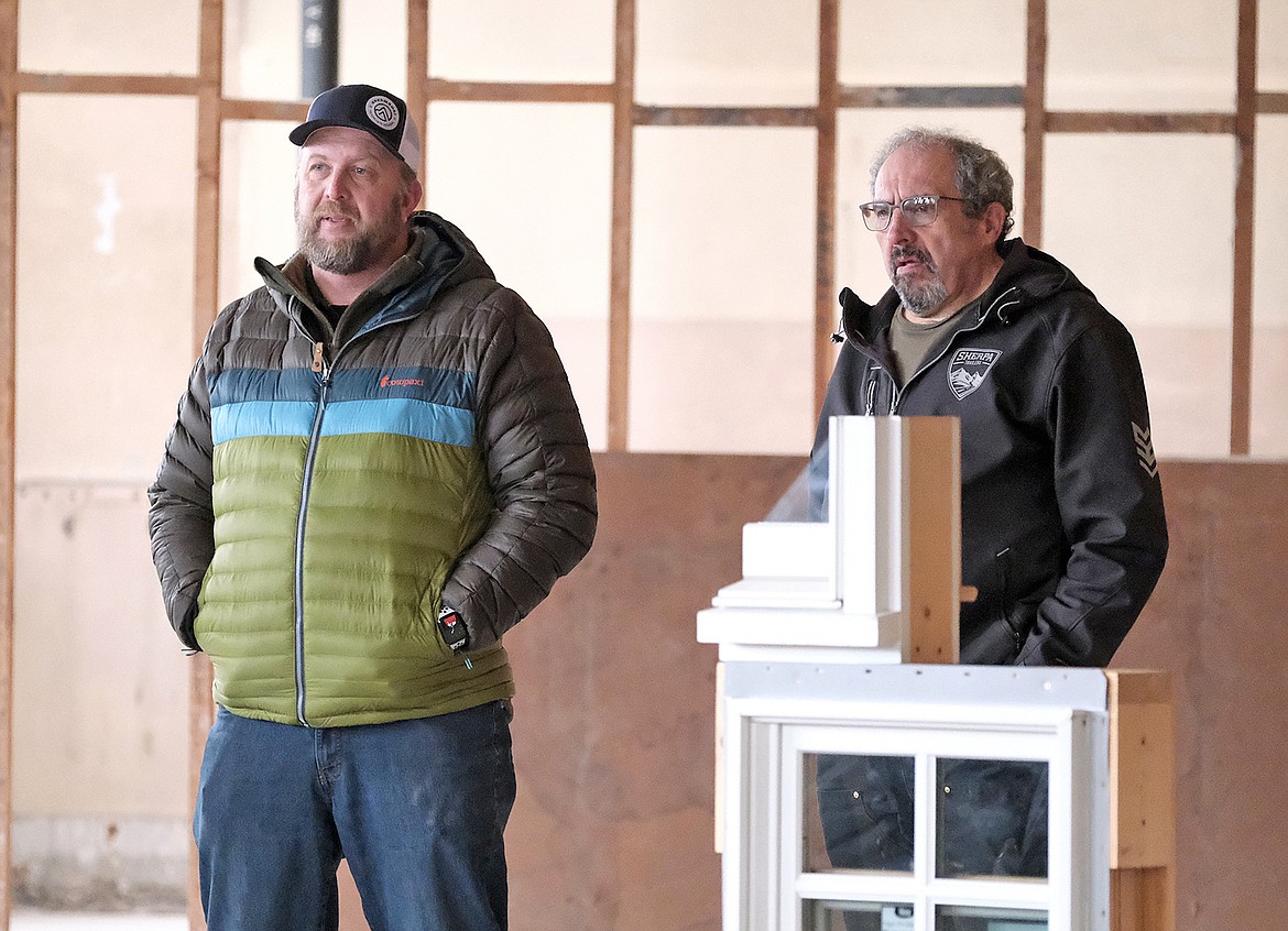 Developers Zach McNew, left, and Bruce Weatherby were involved in the presentation during a Jan. 31 tour at the old high school in Libby. (Paul Sievers/The Western News)