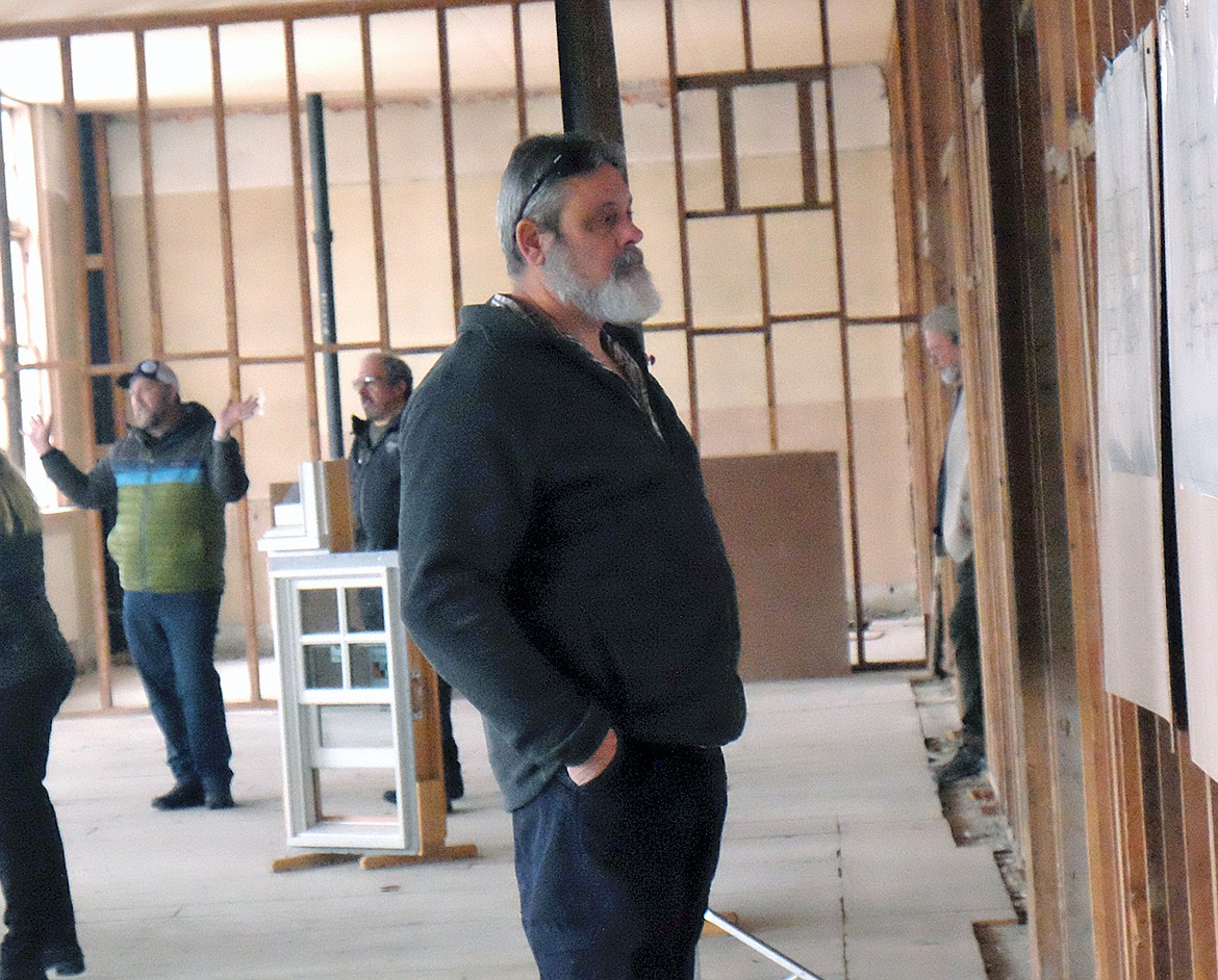 Libby resident and District 1 County Commissioner Brent Teske looks at renovation plans for the old high school during a Jan. 31 tour. (Paul Sievers/The Western News)