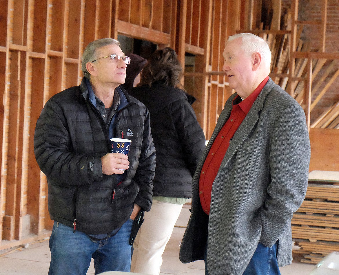 Former Lincoln County Commissioner Jerry Bennett and state Sen. Mike Cuffe chat during a tour discussing renovation plans for the old high school during a Jan. 31 tour. (Paul Sievers/The Western News)