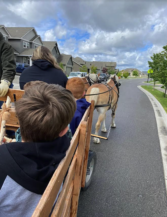 Students enjoy a ride in a horse-drawn wagon during Greensferry Elementary School's 2023 Idaho History Rendezvous.