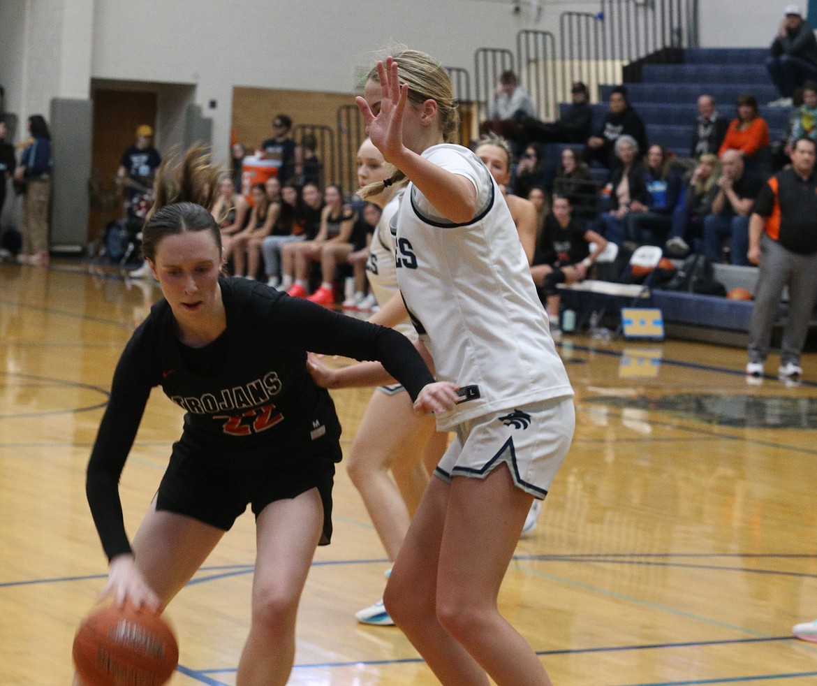 JASON ELLIOTT/Press
Post Falls senior Leti Asper backs into the key on Lake City senior Avery Waddington during the first half of Thursday's 5A Region 1 second-place game at Lake City High.