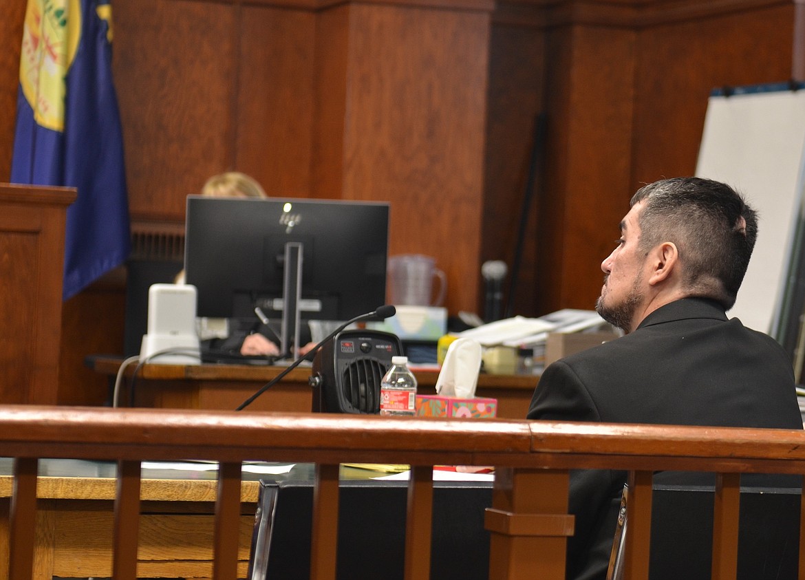 Craig McCrea, who is accused of four counts of arson, listens as his attorney makes his opening statement in the case Monday morning at the Lake County Courthouse. (Kristi Niemeyer/Leader)