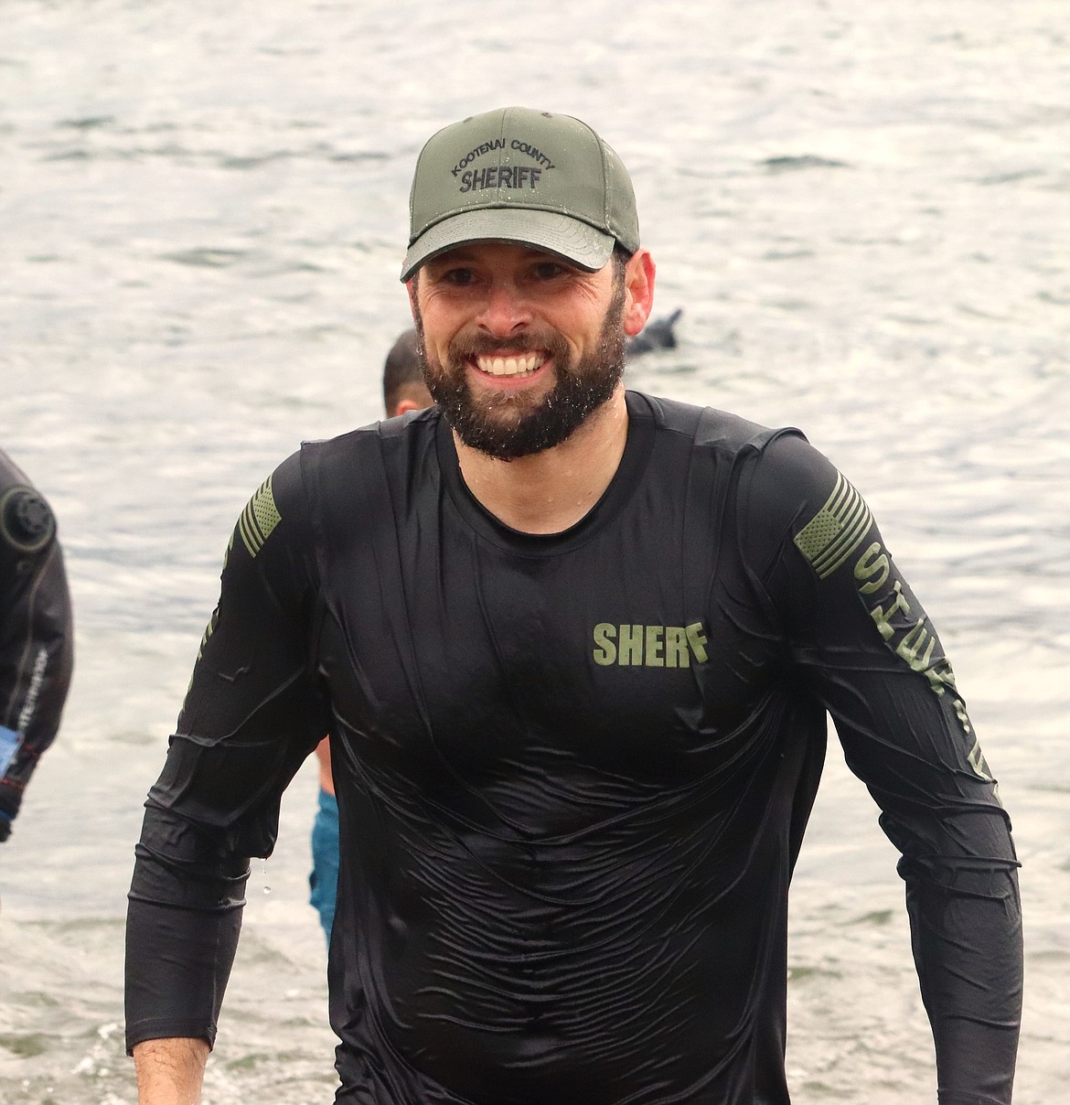 Jonathan Traw leaves Lake Coeur d'Alene after taking the Valentine's Polar Plunge on Thursday.