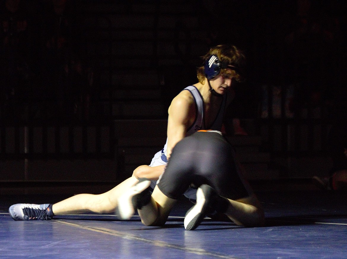 Hunter Pope (138) tries to tire out his Post Falls opponent on Feb. 7.