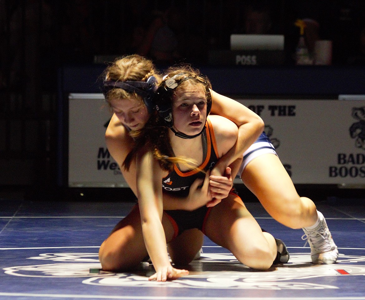 Sofia Brown (132) wrestles against Raylee Reynolds of Post Falls on Feb. 7.