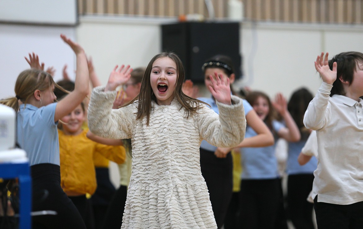 Fifth grader Navy Lauri gets her groove on Friday during a cultural dance performance at Sorensen Magnet School.