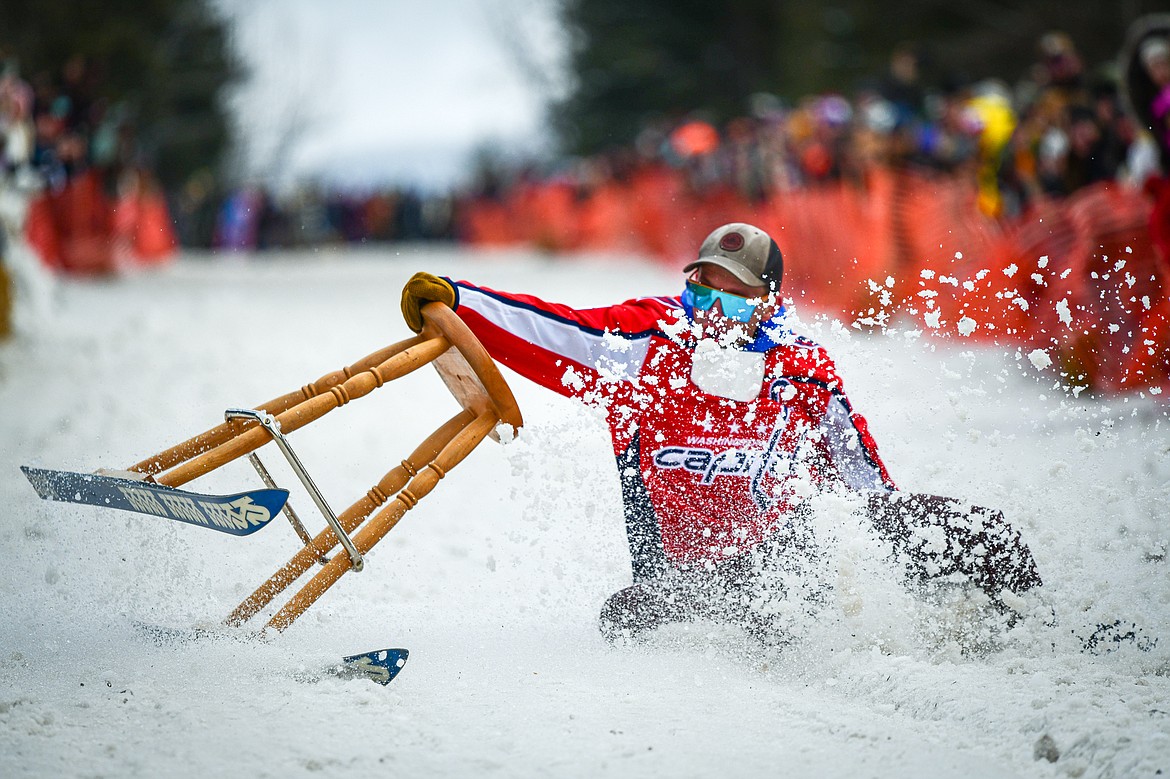 A participant crashes during the Barstool Ski Races at Cabin Fever Days in Martin City on Saturday, Feb. 10. (Casey Kreider/Daily Inter Lake)