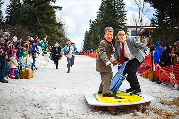 Participants race down Sugar Hill during the Barstool Ski Races at Cabin Fever Days in Martin City on Saturday, Feb. 10. (Casey Kreider/Daily Inter Lake)