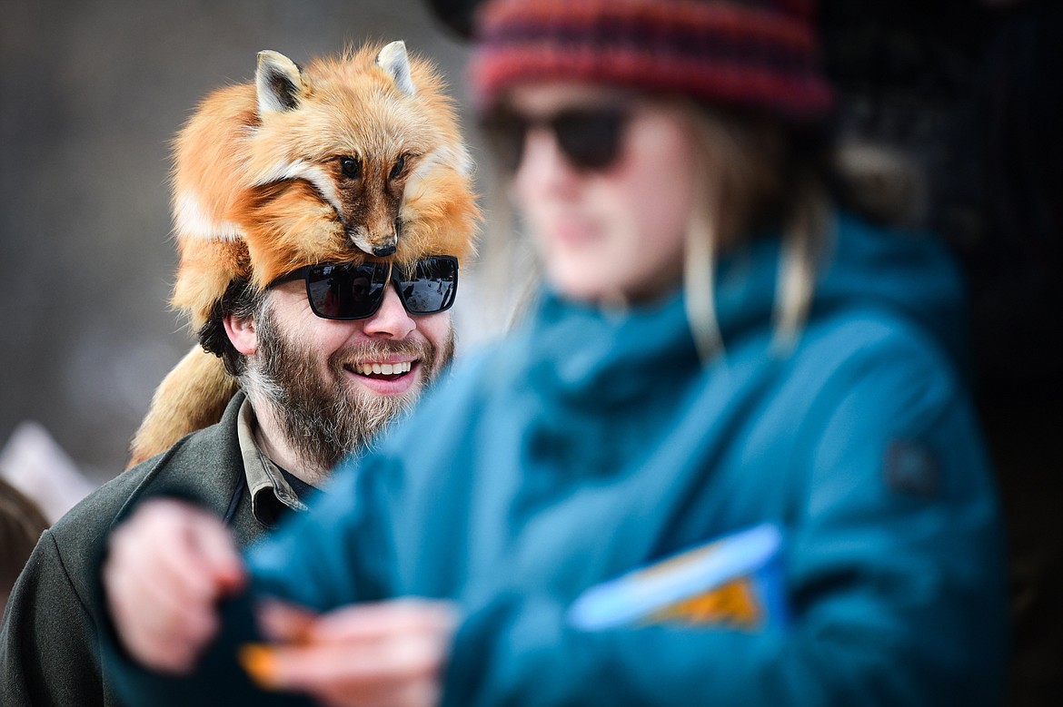 An attendee wears a fox fur hat at the Barstool Ski Races at Cabin Fever Days in Martin City on Saturday, Feb. 10. (Casey Kreider/Daily Inter Lake)