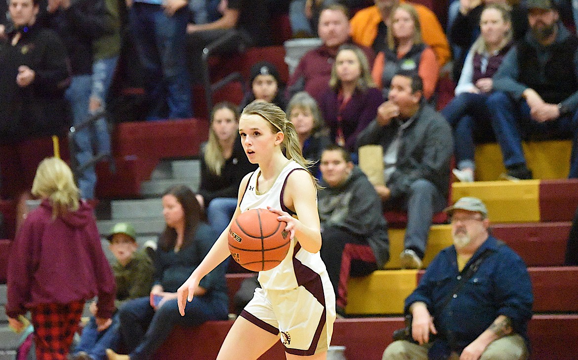 Troy's Kirsti Jellesed brings the ball up the court on Feb. 8 against Thompson Falls. (Scott Shindledecker/The Western News)