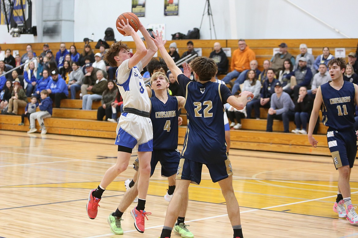 Soap Lake senior Trey Landdeck, in white, led the Eagles with 17 points in their win over Riverside Christian Friday night.