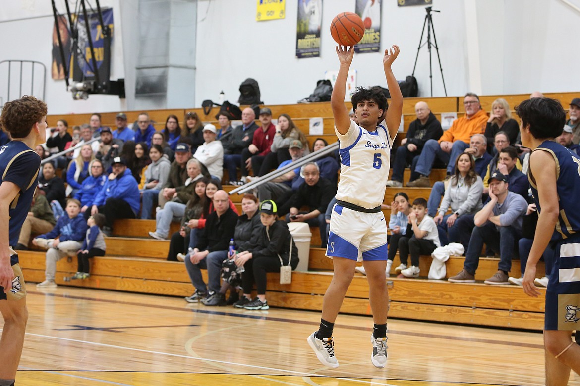 Soap Lake junior Jairo Lopez (5) shoots a three-pointer in the first half against Riverside Christian.