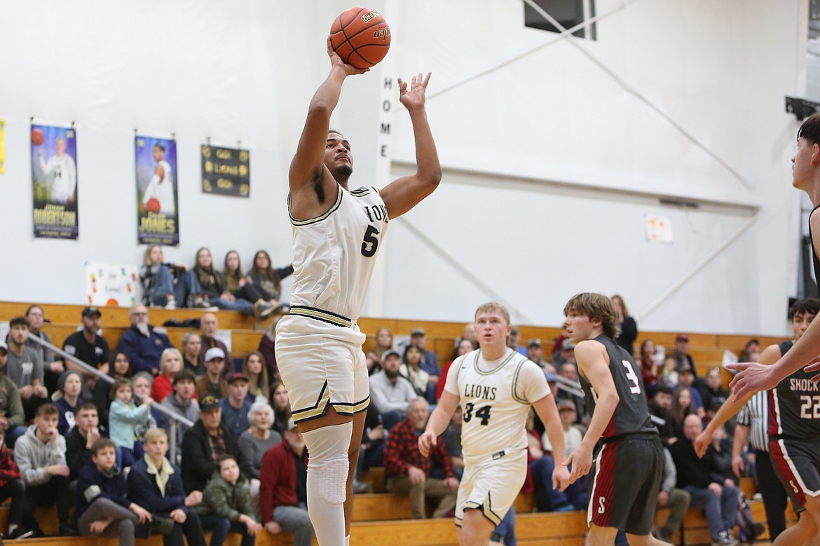 MLCA/CCS senior Caleb Jones attempts a shot in the fourth quarter Friday night against Waterville-Mansfield.