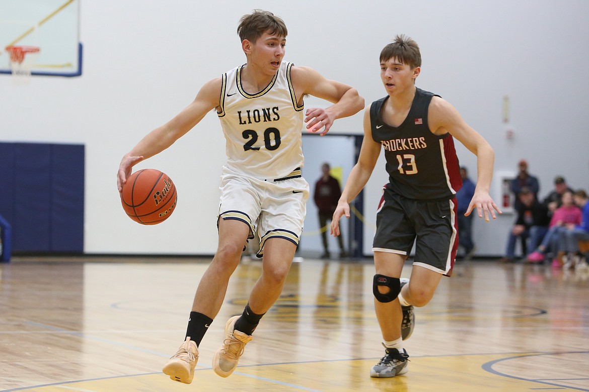 Soap Lake junior Ruvim Goloborodko, left, attempts a shot in the first half.