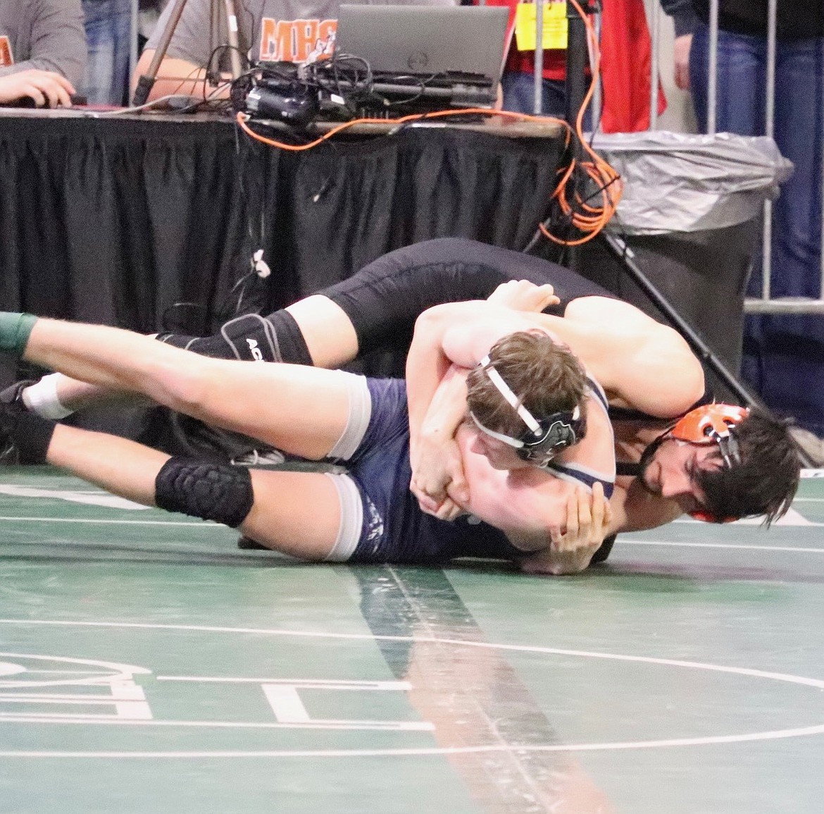 Plains/Hot Springs senior Drew Carey takes down his 138 pound opponent  during the All-Class Montana Wrestling championship meet this past weekend in Billings. (Photo by Kami Miender)