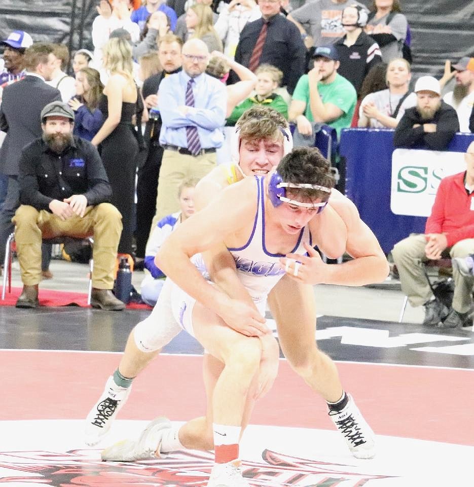 Thompson Falls' senior Max Hannum, (rear) looks for a take down opportunity during his bout at this year's state wrestling championships in Billings.  (Photo by Kami Milender)