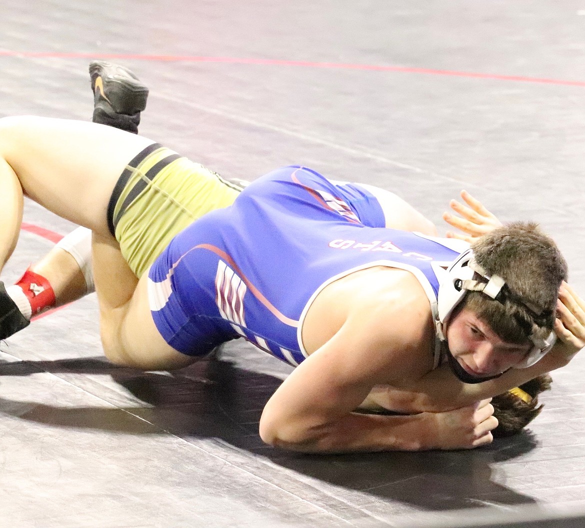 Superior freshman Turner Milender, top, looks for a pin signal during his 160-pound match at this year's All-Class wrestling championship in Billings.  Milender finished fifth in his weight class.  (Photo by Kami Milender)