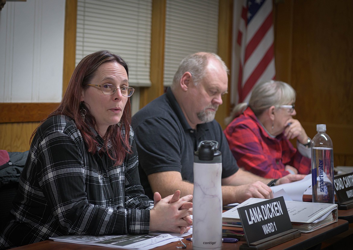 Plains Council members Lana Dicken, Chad Cantrell and Connie Foust review the town's new lawnmower purchase. (Tracy Scott/Valley Press)