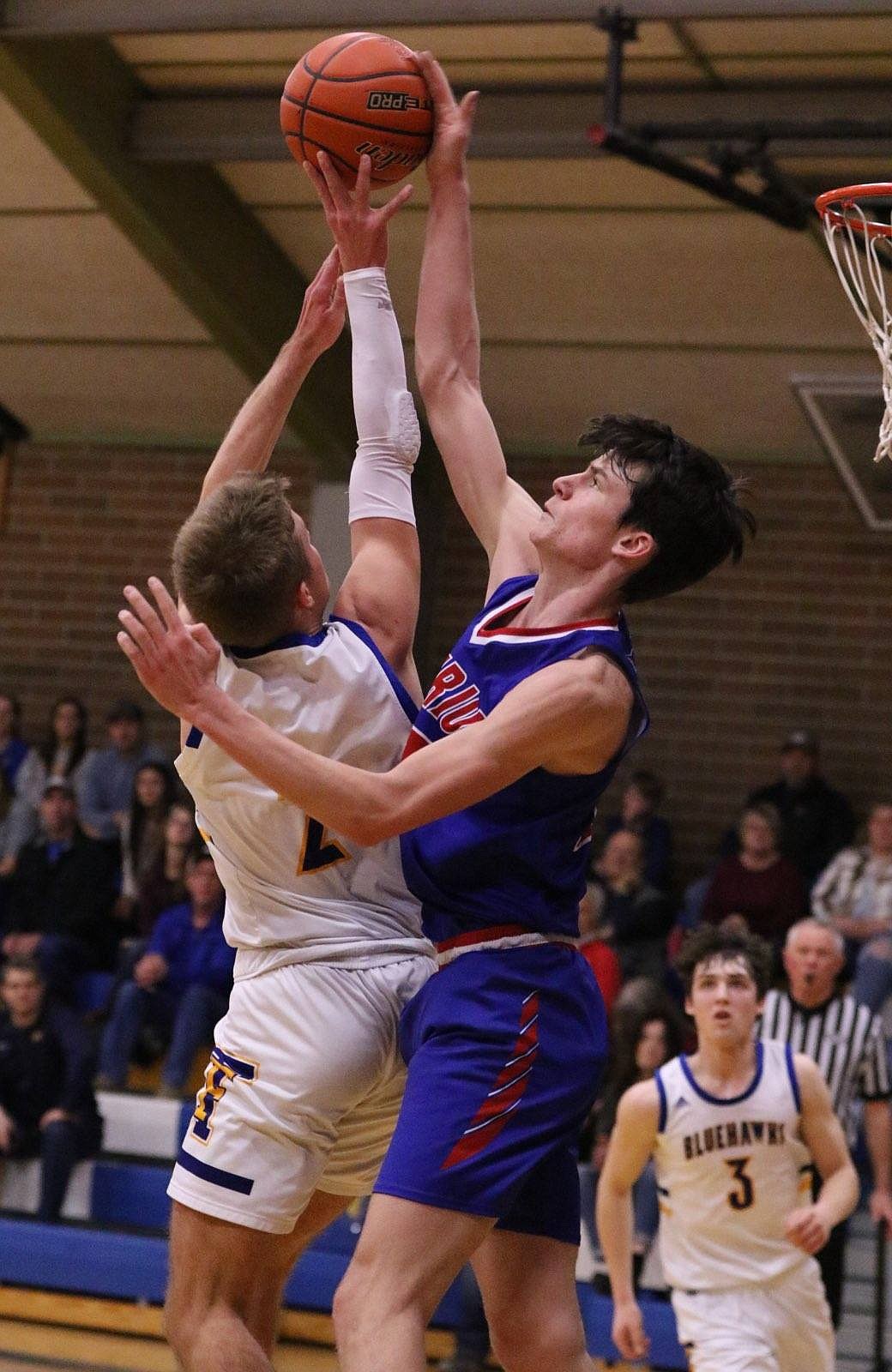 Bobcats 6-5 freshman post Landon Richards blocks a shot attempt by Thompson Falls' Nick Tessier during their game Saturday night in T Falls.  (photo by Byron Quinlan)