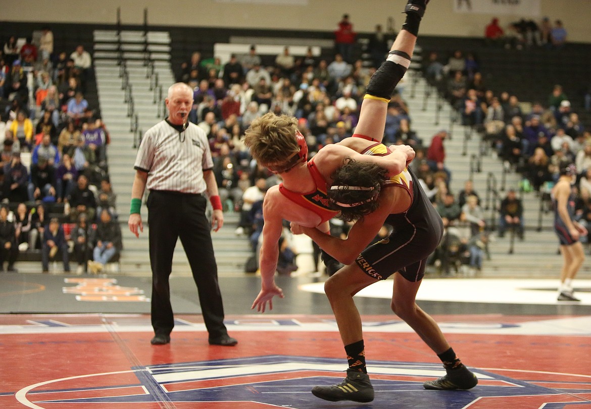 Moses Lake freshman Duane Zamora, right, takes down his opponent at Saturday’s 4A Region 4 tournament in Yakima. Zamora is one of five Mavs heading to the Mat Classic.