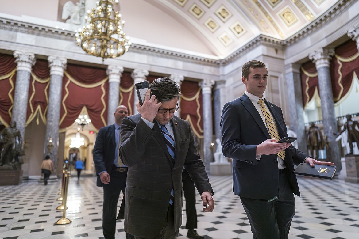 House Speaker Mike Johnson, R-La., walks through statuary Hall as lawmakers gather in the House chamber to vote on the articles of impeachment against Homeland Security Secretary Alejandro Mayorkas for failures on the U.S.- Mexico border at the Capitol in Washington, Feb. 6, 2024. Having failed to impeach Mayorkas the first time, House Republicans are determined to try again. But it's not at all certain Tuesday's scheduled do-over will produce a better tally.(AP Photo/J. Scott Applewhite, File)