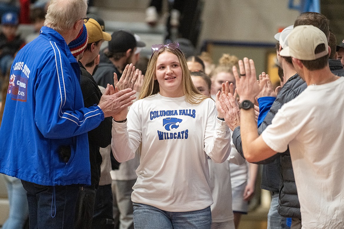 Wildkat Maddie Moultray is greeted by fans for Senior Night Friday, Feb. 9. (Avery Howe photo)